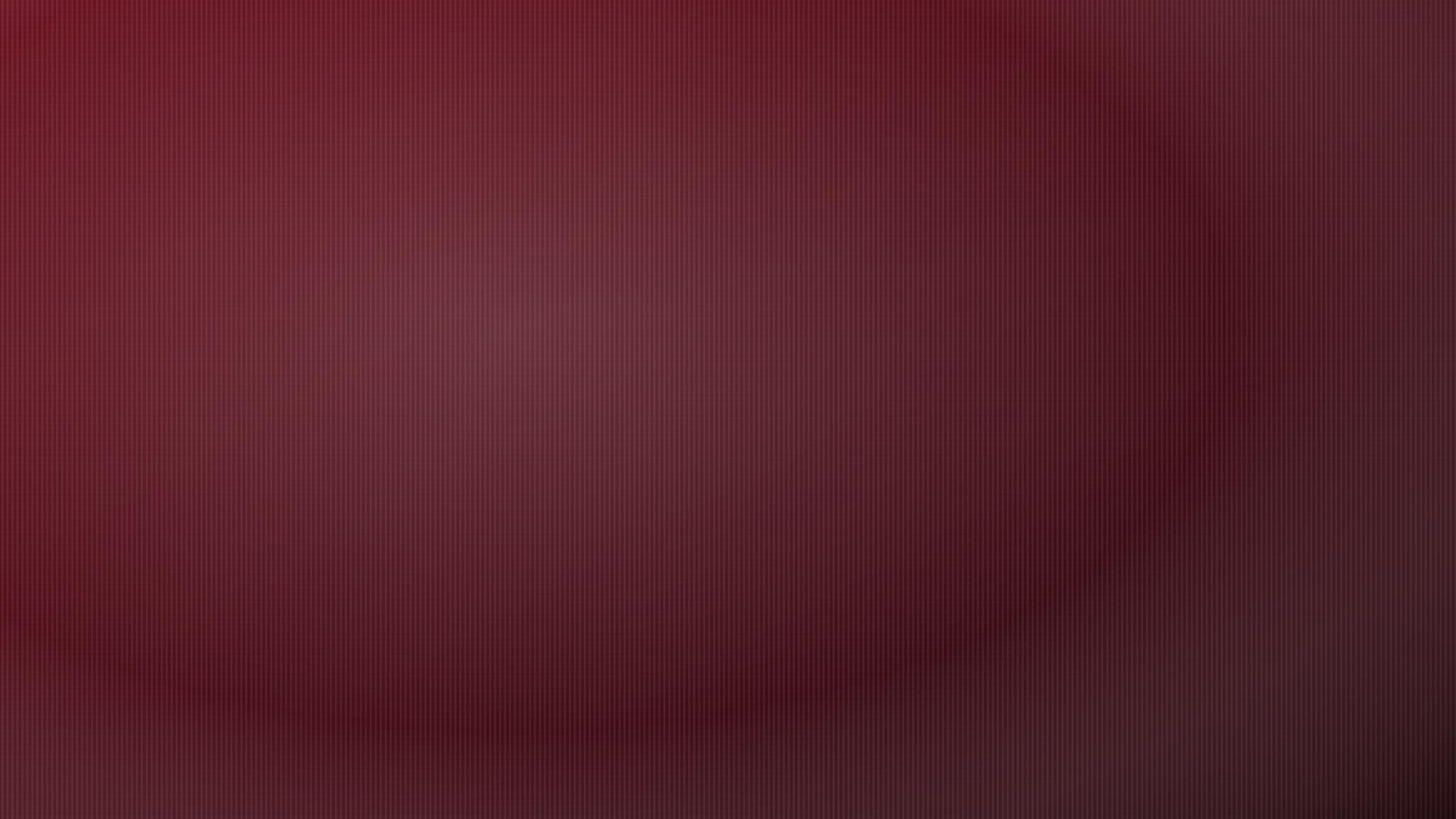 Luxurious draped fabric in deep oxblood and bone tones, representing Ozain Fabrics' finished textiles