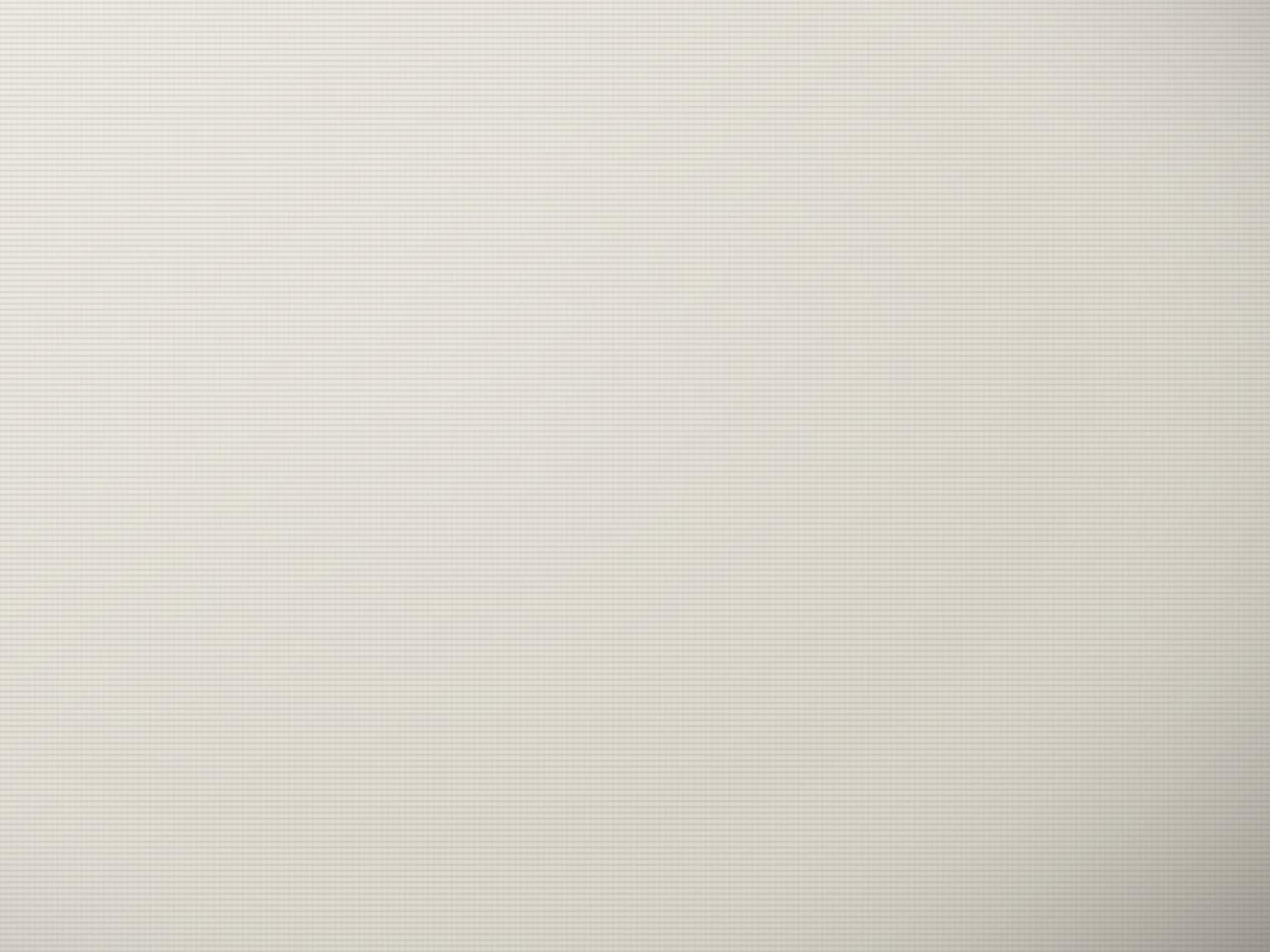 Pristine white ready-for-dyeing fabric rolls stacked in a warehouse